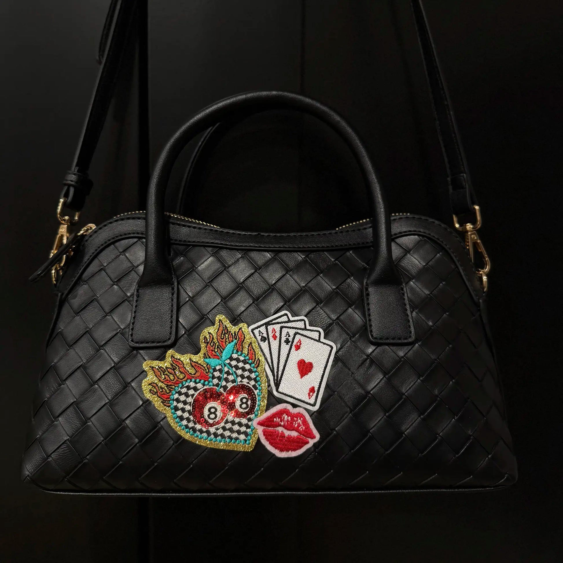 Black woven faux leather satchel purse with gold hardware and embroidered patch featuring playing cards, 8 balls, flames, and lips, from Moonlight Market
